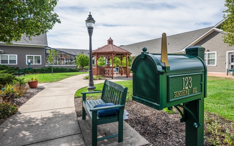 Outdoor path with bench and mailbox
