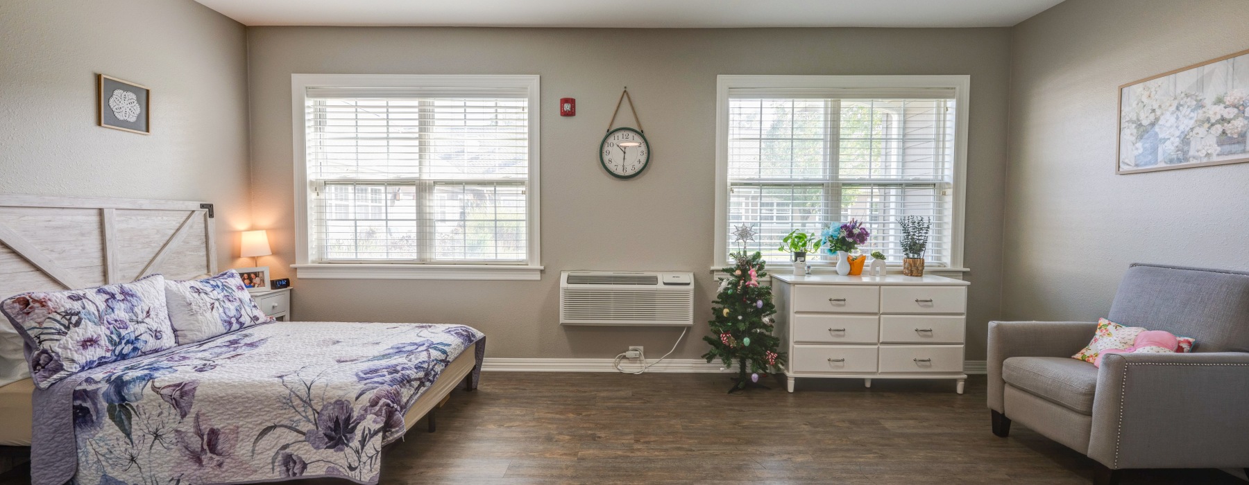 Bedroom with bed, sofa, and dresser