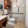 a bathroom with a toilet sink and a mirror