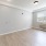 a room with a wood floor and a white door
