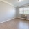 a room with a wood floor and a window